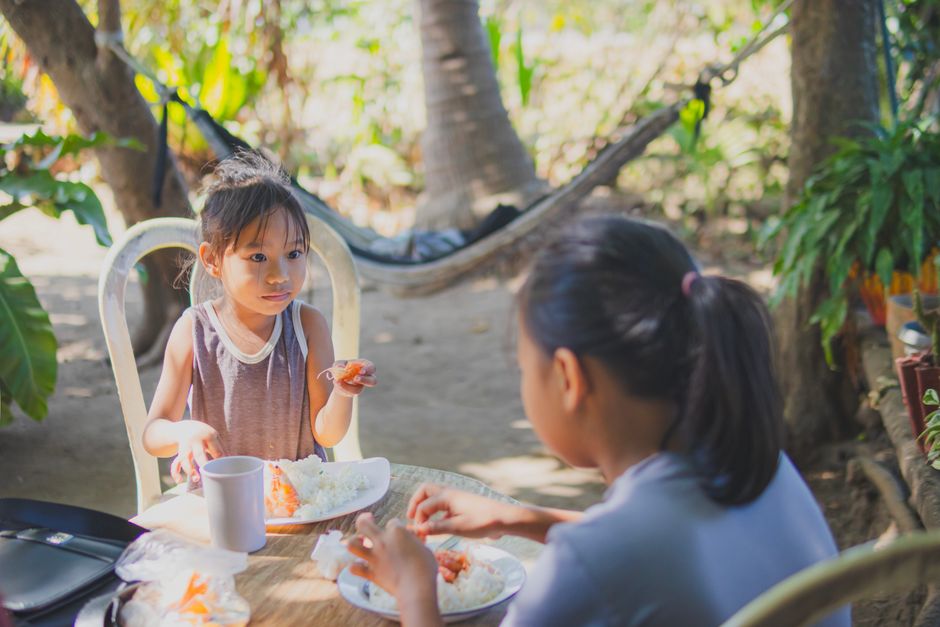 child playing with rice