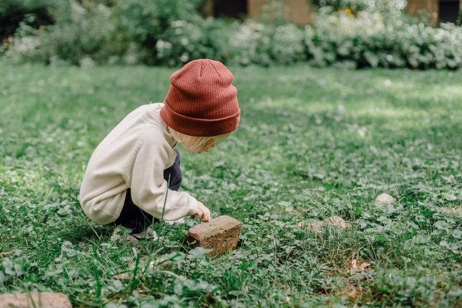 child exploring backyard nature