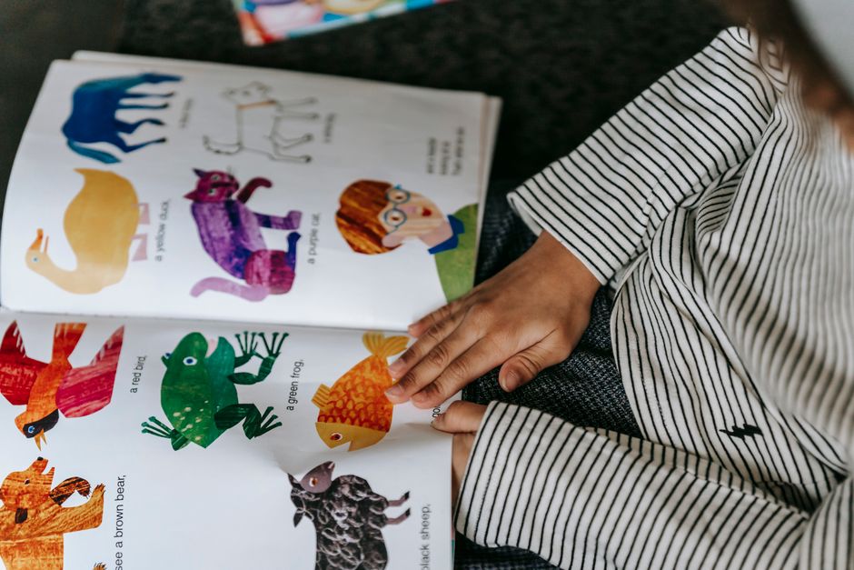 child reading picture book
