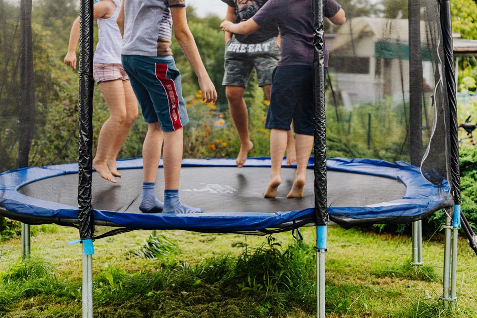 children jumping outdoors