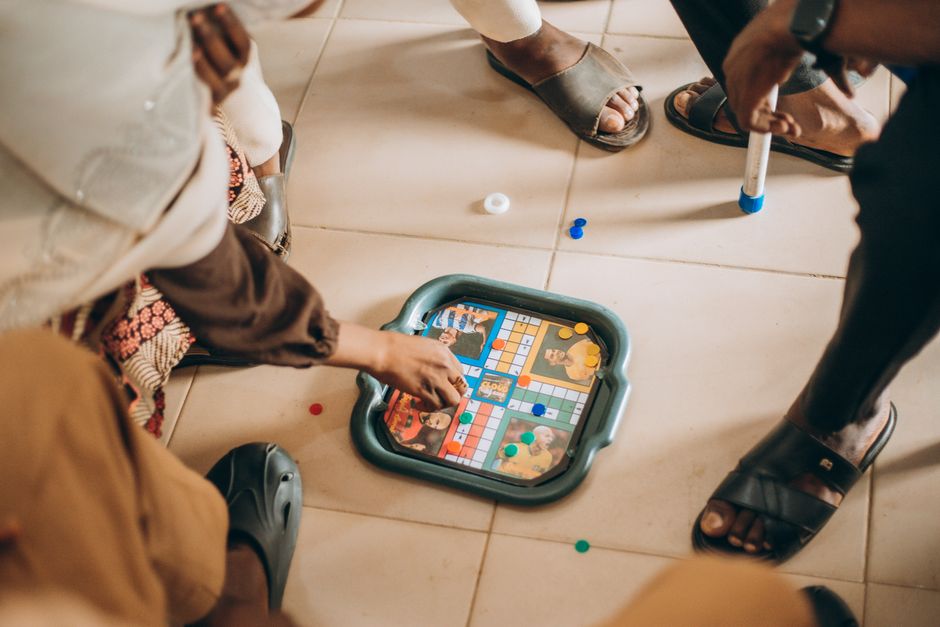 family playing board game