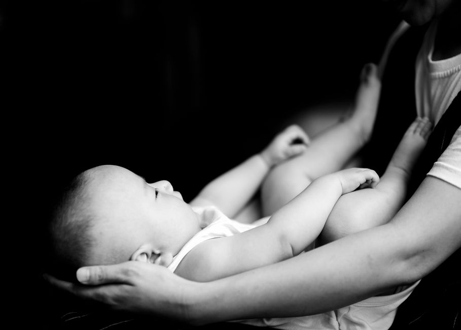 newborn baby being held