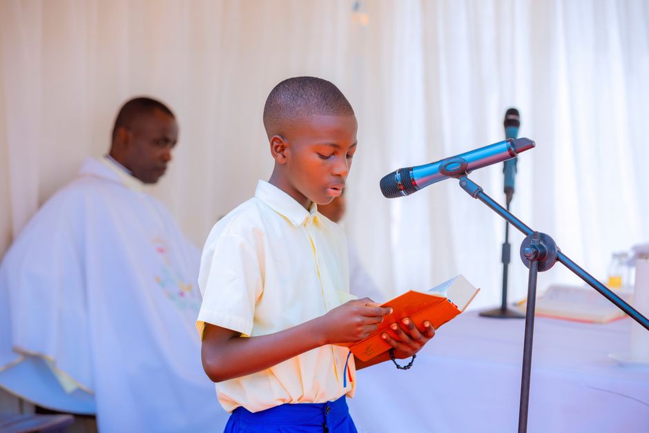 child speaking into microphone