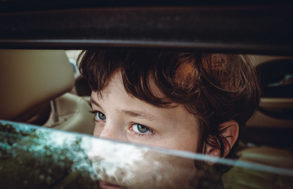 child looking out car window